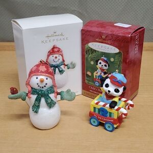 2 Hallmark snowman & Panda with train collectible ornaments.